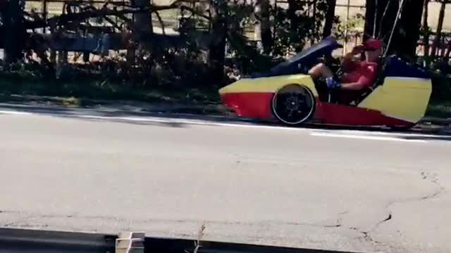 Language nsfw cool cat though snapchat guy in red and yellow cart on street with american flag