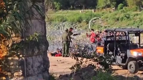 Border Patrol agents cut the wire for migrants to enter through the southern border
