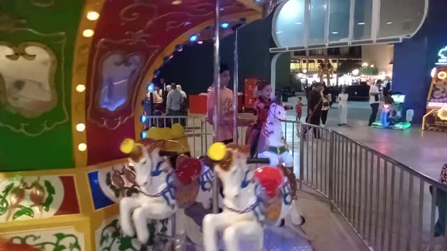 Baby in the amusement park