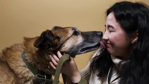 Woman kissing with Pet Dog