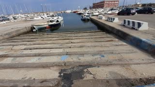 Walking on a platform where the boats sailed