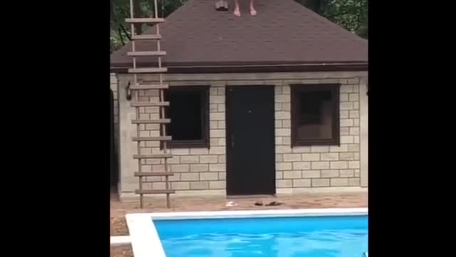 GRAPHIC CONTENT WARNING - Guy Jumps Off Roof To Pool But Faceplants Concrete