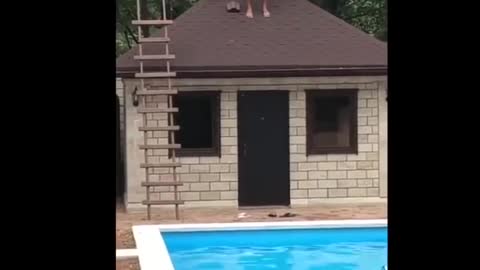 GRAPHIC CONTENT WARNING - Guy Jumps Off Roof To Pool But Faceplants Concrete