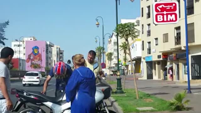 Motorcycle Sideswipes Parked Car