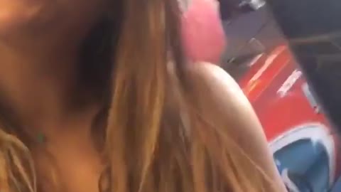 Girl gets close to fan fan sucks in her hair