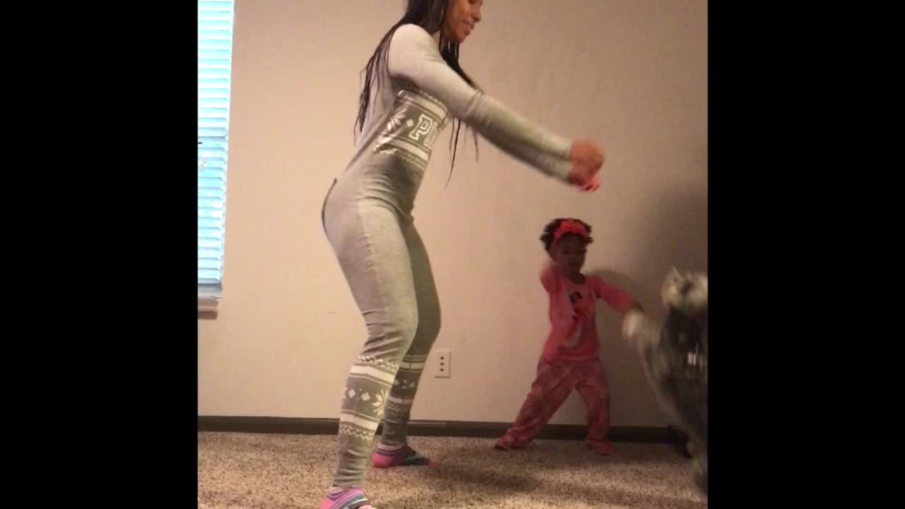 Mom, daughter & doggy have pajama dance party