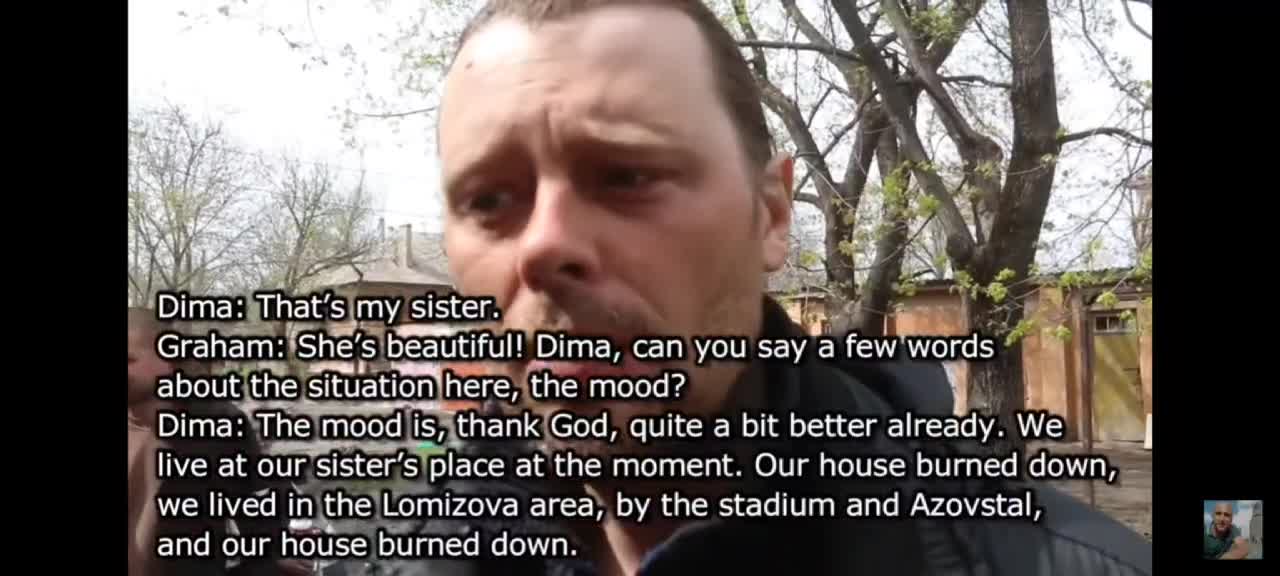 Mariupol residents speak to Graham Phillips. This man's home burnt down.