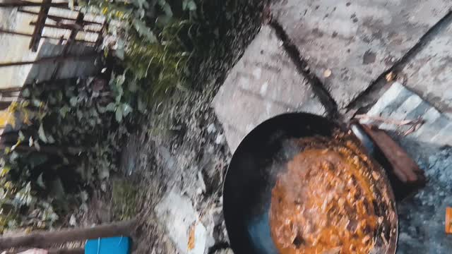 Boys making meat for the party