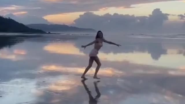 Gisele Bundchen celebrates Earth Day 2022 leaping into the air