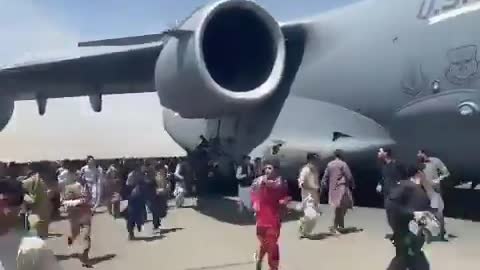 Afghani's Holding Onto Plane Attempting To Leave Kabul