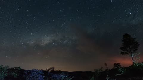 Timelapse of a starry sky in the countryside