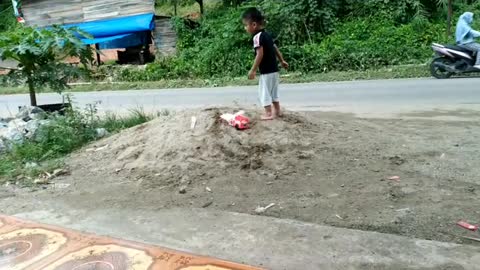 playing truck in the sand