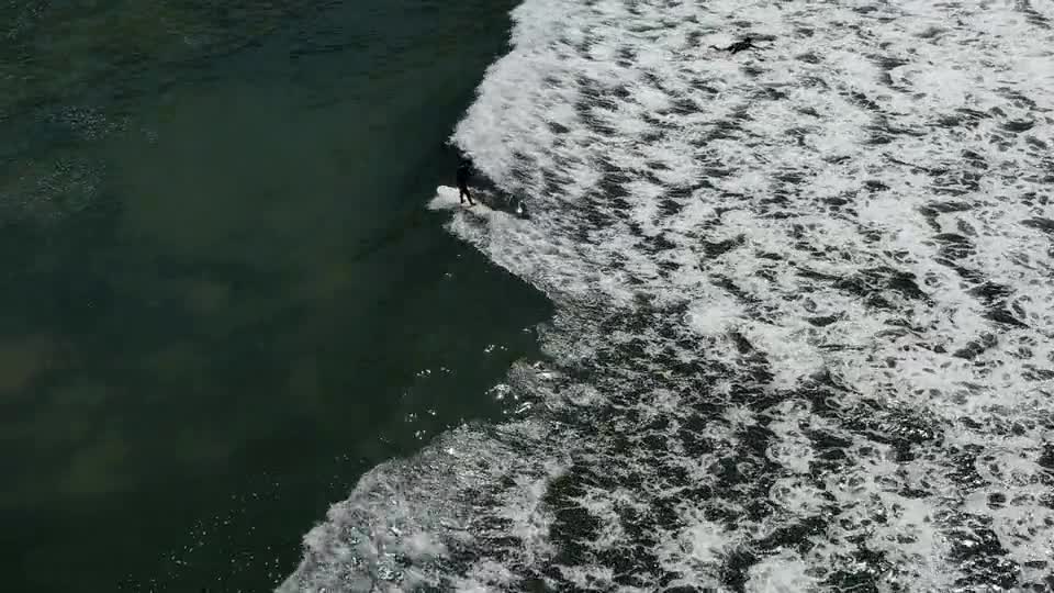 Man Riding a Surfboard