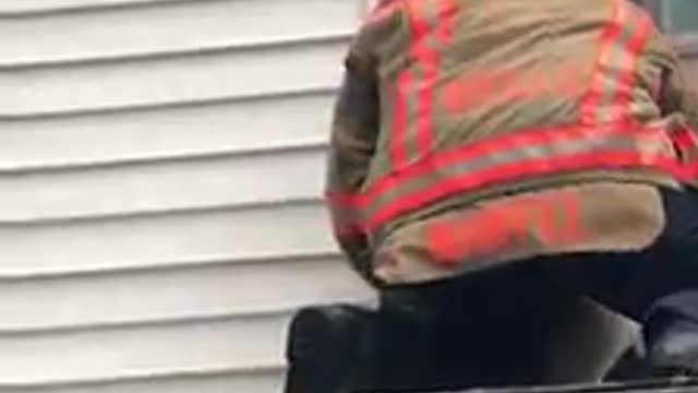 Fire Department Captain saves dog stuck on top of roof