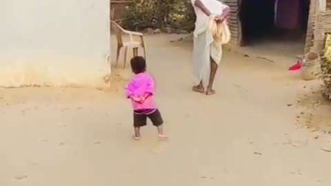 little child imitating grandfather