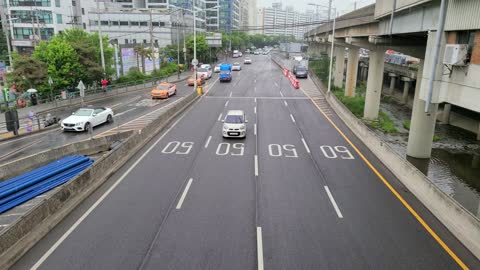 Cars running on a rainy day