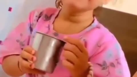 Cute girl drinking milk