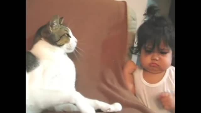 Baby touching cat cute_moment