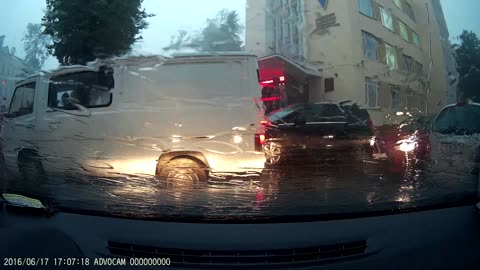 A Tree Falls on a Car During a Storm in Belarus