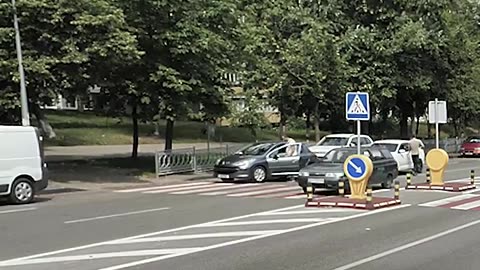 Good mans step in to help old lady cross a busy road