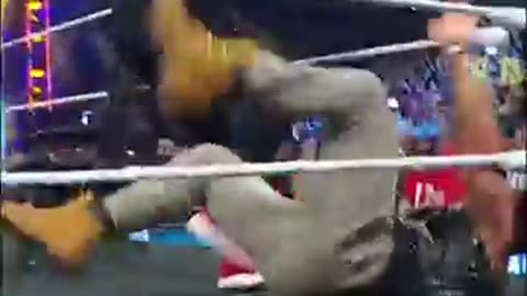 Roman_Reigns_flips_a_table_on_LA_Knight_#smackdown(360p)