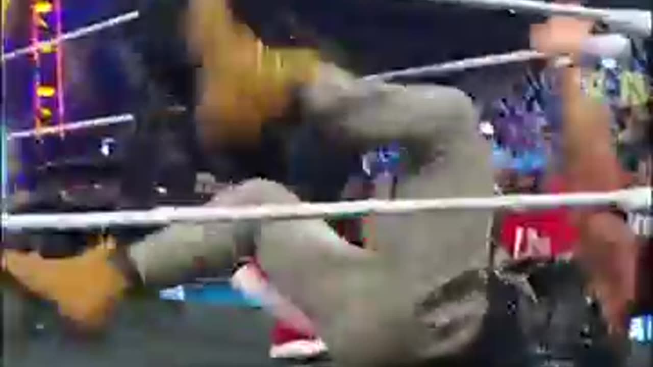 Roman_Reigns_flips_a_table_on_LA_Knight_#smackdown(360p)