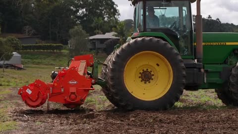 Tractor harvesting crops