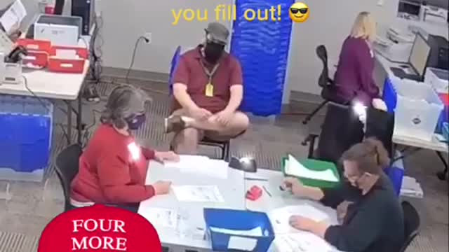 Woman Filling In Blank Ballots