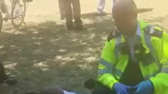 Racist police officer beating up black boy