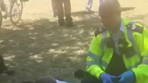 Racist police officer beating up black boy