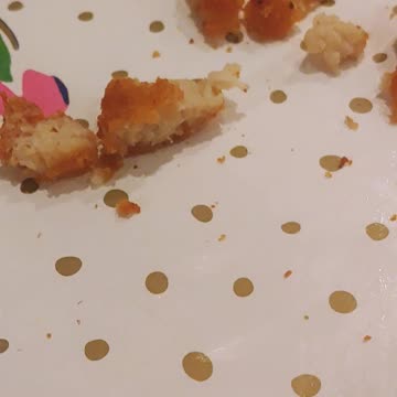 Cute baby falling asleep at the table.