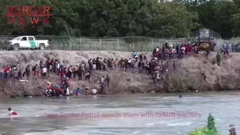 RAW VIDEO, Border Patrol using fork lifts to raise wire so migrant can cross