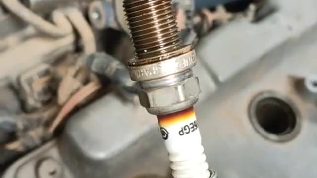 Handy tool for removing spark plugs