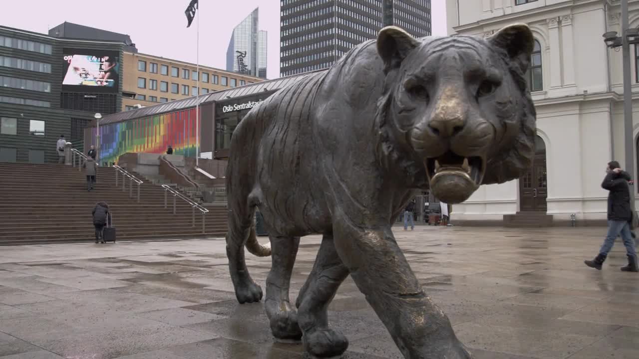 Panning shot of Tiger Statue in Oslo Norway - Central Station