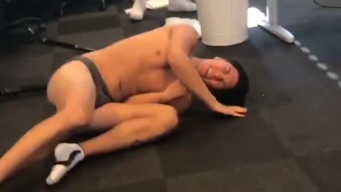 Guy running in underwear falls down