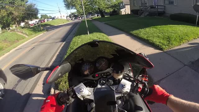 Motorcycle Vlogger Crashes After Attempt to Throw Business Cards