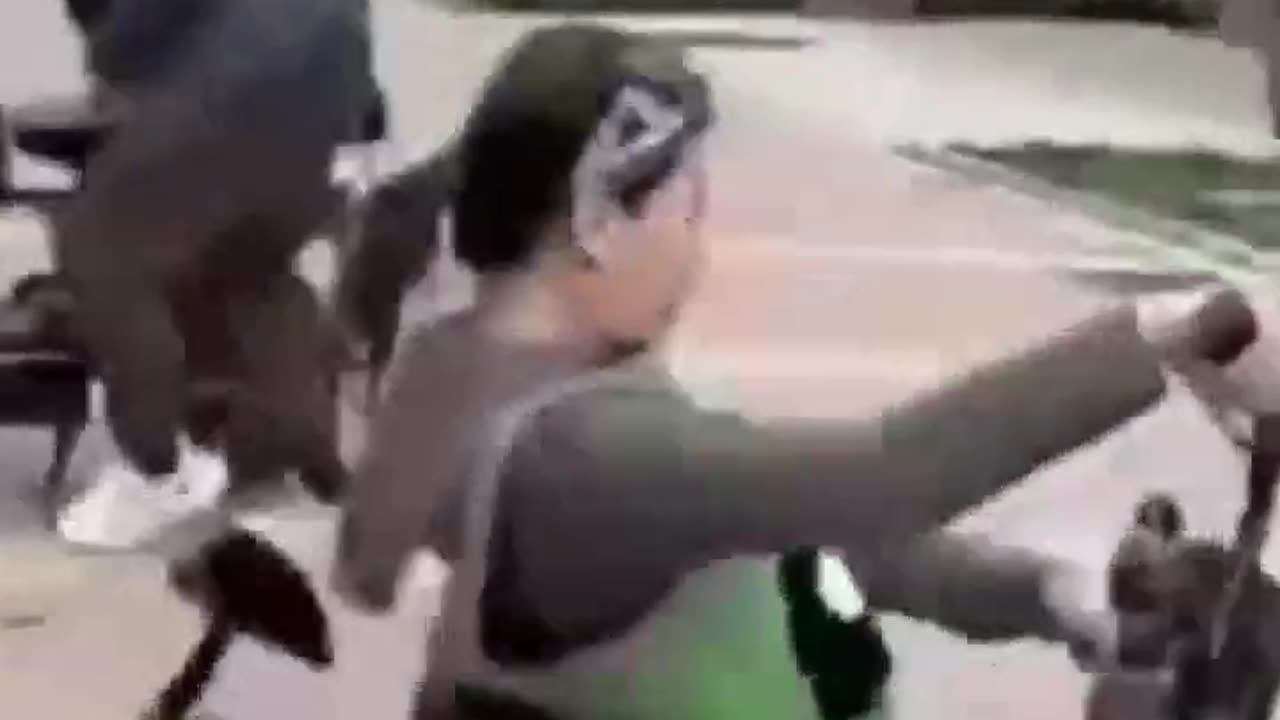 "Comic Showdown: Hilarious Motorcycle Duel and the Lady's Spinning Spectacle!"