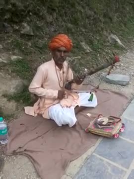 An Old Man Playing a Traditional Musical Instrument, Himachal, India