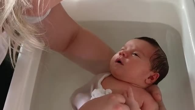 Baby sleeping in the bathtub