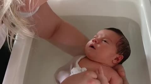 Baby sleeping in the bathtub