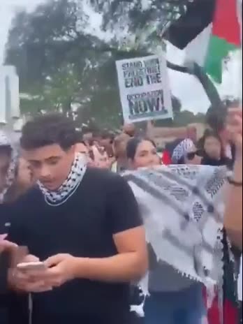 American Muslim happily shows off bodies of dead Israeli civilians