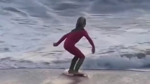 funny skills little girl on the beach