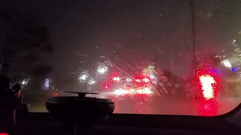 It's raining, driving.