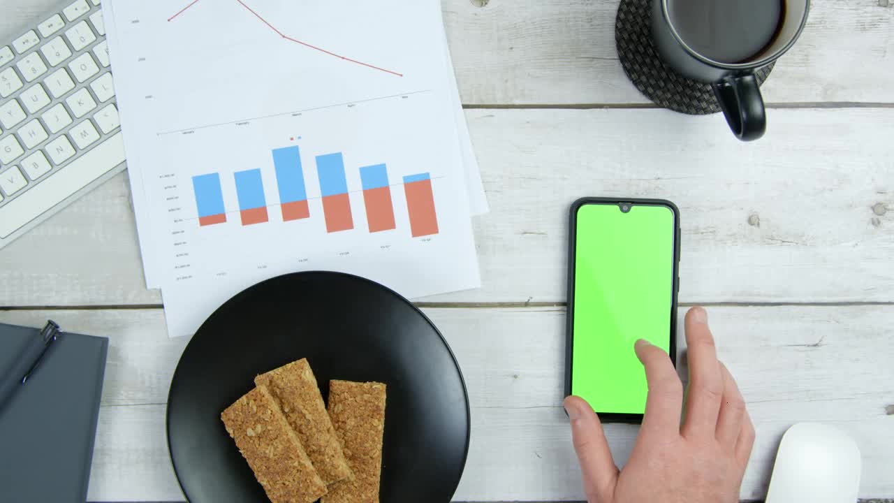 Top View Male Hands Using Computer and Mobile Phone Green Screen