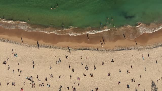 People Enjoying The Beach