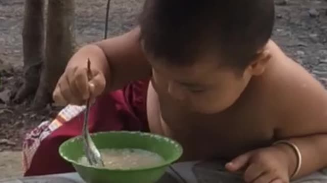 The baby eats very deliciously