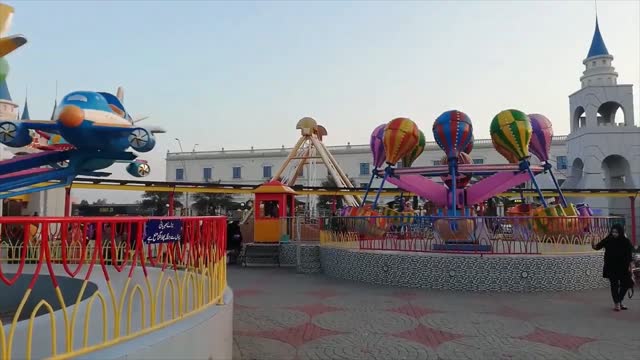 Adorable Childs are amusing with Aeroplane Ride At Theme park.