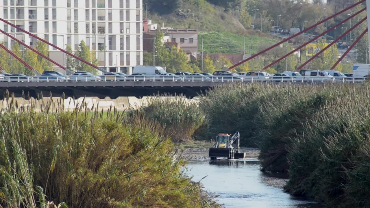 Secret Tractor Working Under Traffic Bridge With Taxi Cars