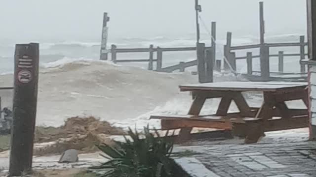 Waves from storm completely messing up pier and seawall