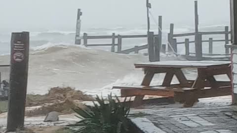 Waves from storm completely messing up pier and seawall